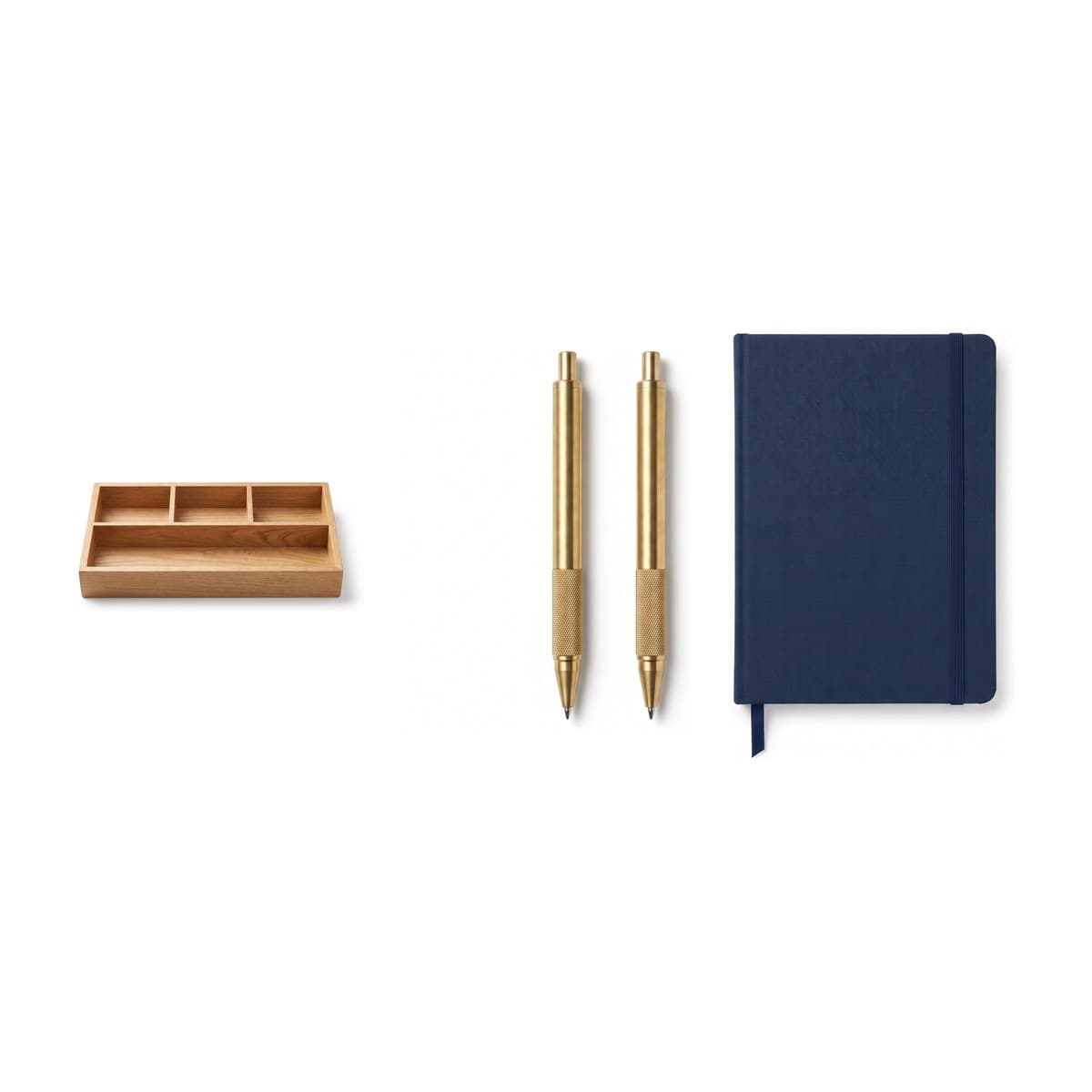 The pieces of the Desk Refresh Gift Set together: an oak desk tray, two brass pens and a hardcover notebook
